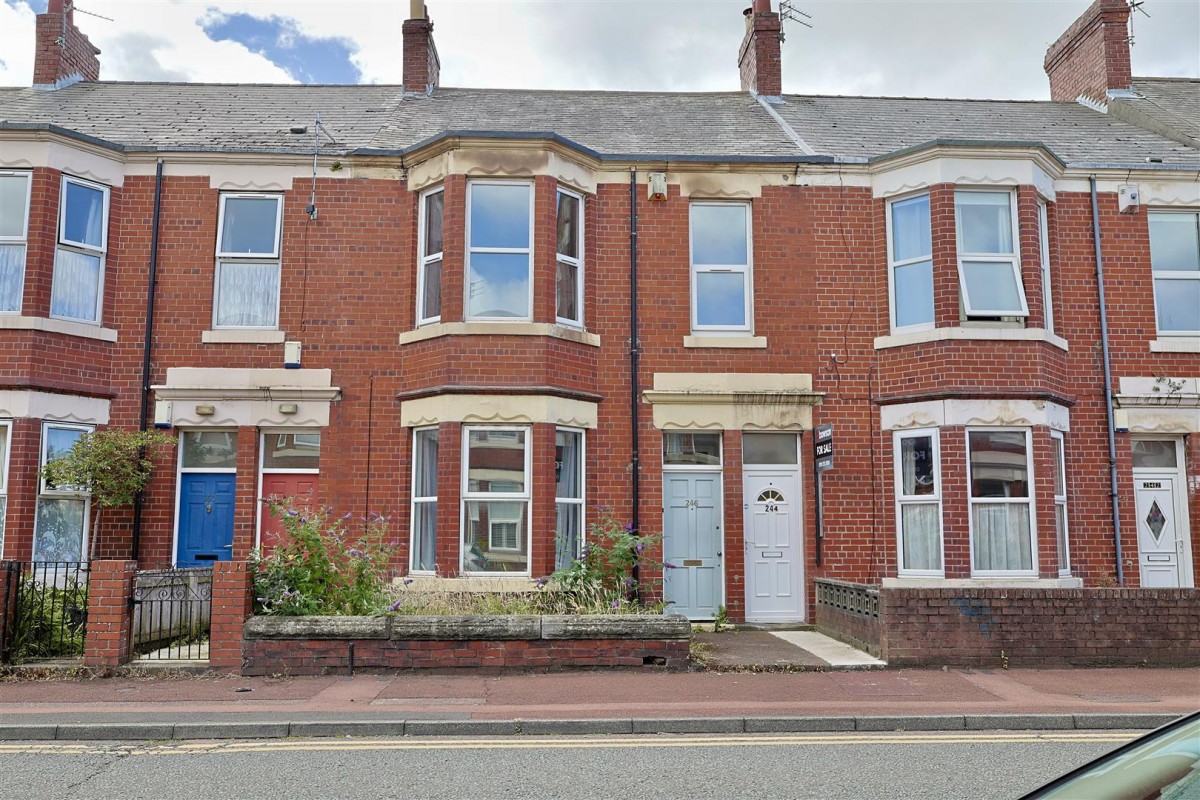 Red-brick Tyneside flats with paired front doors on a terraced street in Heaton, Newcastle NE6, marketed by Bowson estate agents