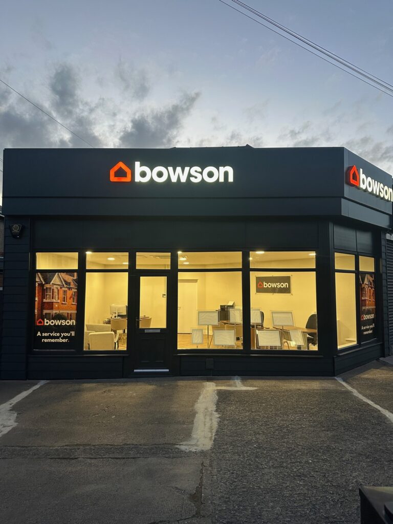 The Bowson office on Benton Road, High Heaton, lit up at dusk