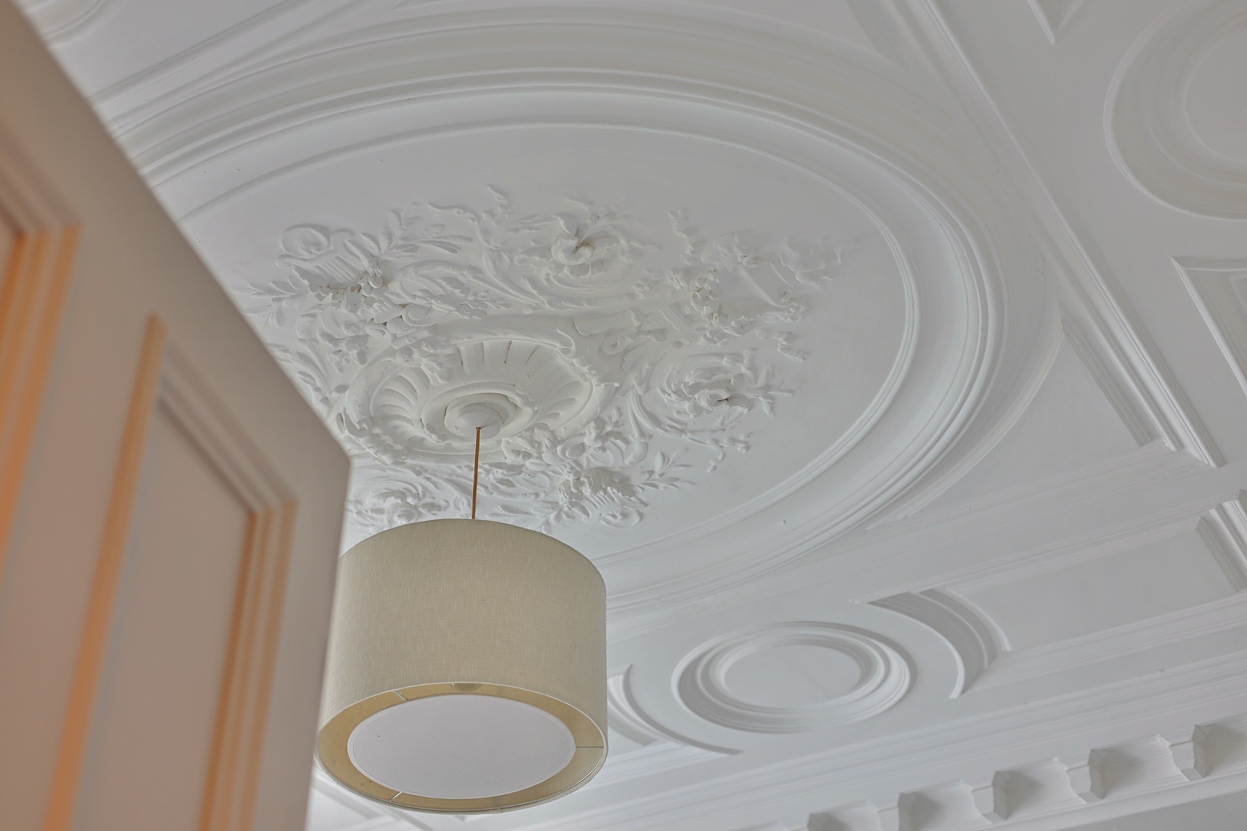 Ornate original plaster ceiling rose in a period terrace